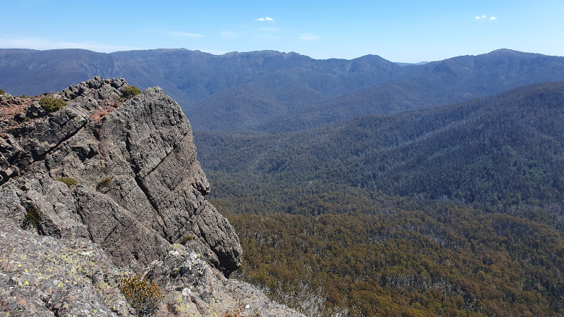 Rock outcrop in foreground of panoramic view of Australian Alps
