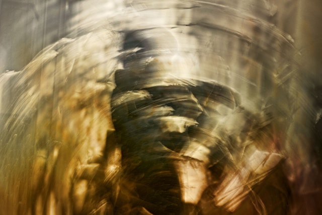 Abstracted figure, as though seen through a circularly distorting lens